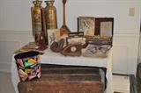 Vintage copper and brass fire extinguishers (one converted to a table lamp), vintage Russian Balalaika, brass trumpet in case, antique sheet music, old music books, vintage baseball catcher's mitt, baseball glove, beautiful old trunk with wood detail and leather handles, old Robinson Crusoe book, National Geographic magazines from 1910 on, vintage college university motif trash basket, set of old encyclopedias.