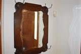 Fabulous and large beveled oak mirror with copper hooks.