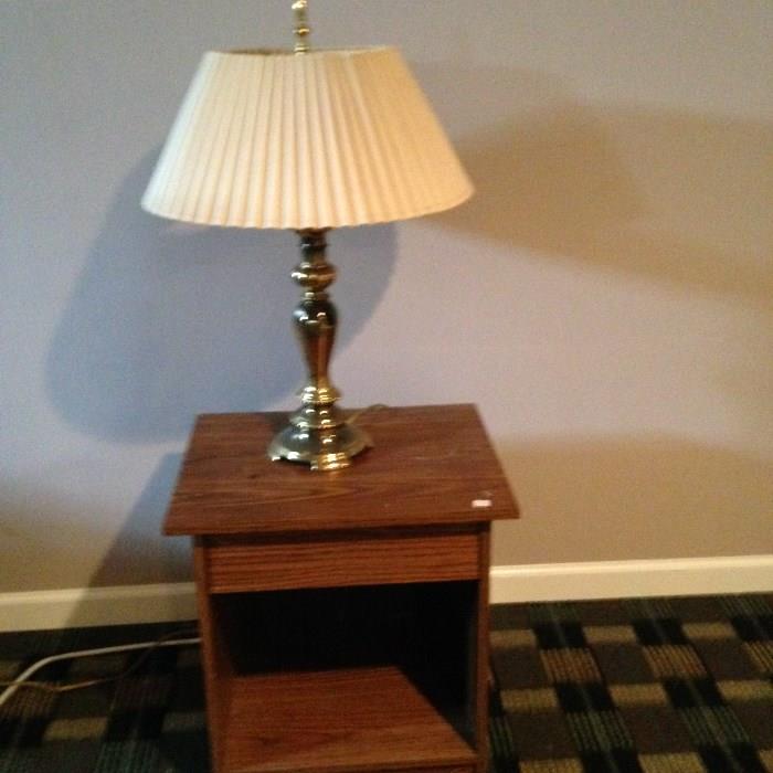 side table and brass lamp