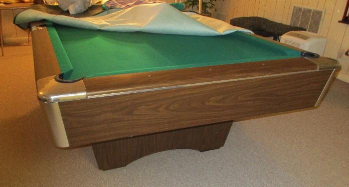 pool table with cover, wall rack, cues, balls