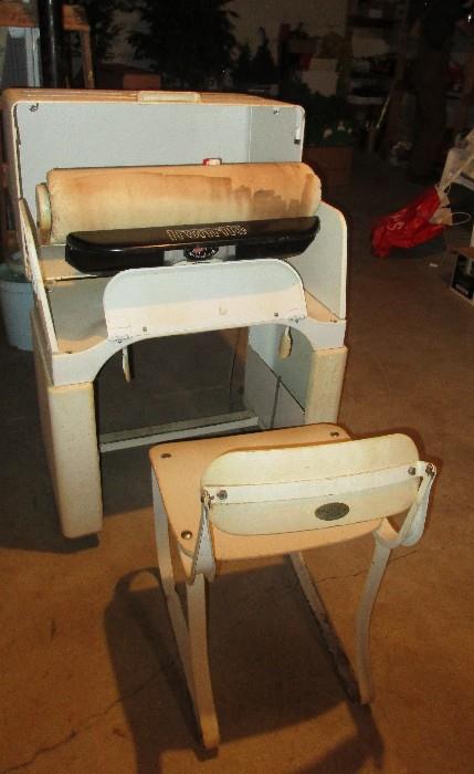Ironrite clothing press with matching chair, so cool.