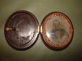Very old wood hinged small pocket size picture frame. Very Very cool item.
