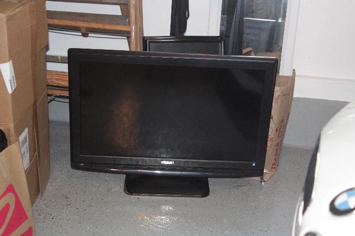 One of three flat-panel tvs.