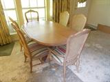 Dining Table - 2 Leaves - Table Pads - 2 Upholstered Chairs Have Arms - 4 Side Upholstered Chairs - Blonde "Washed" Wood - Chairs have cane backs....This Set (which is in the Apartment next to the main house) matches the China/Curio Cabinet which is in the Dining Room of the Main House) from an earlier photo...