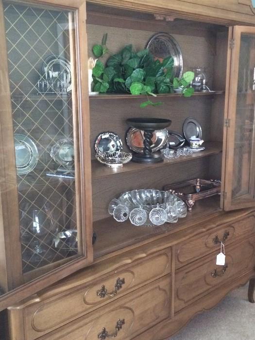 Large china cabinet-matches the dining table;            2nd shelf - Southern Living barley twist cake plate