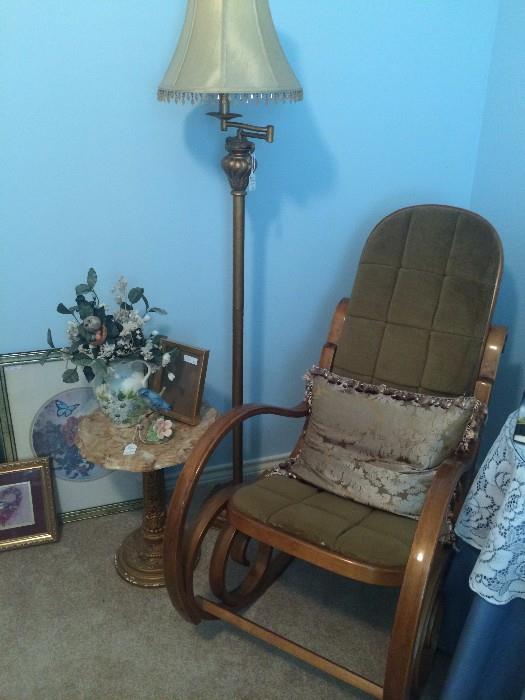 Bentwood rocker, floor lamp, and small marble top table