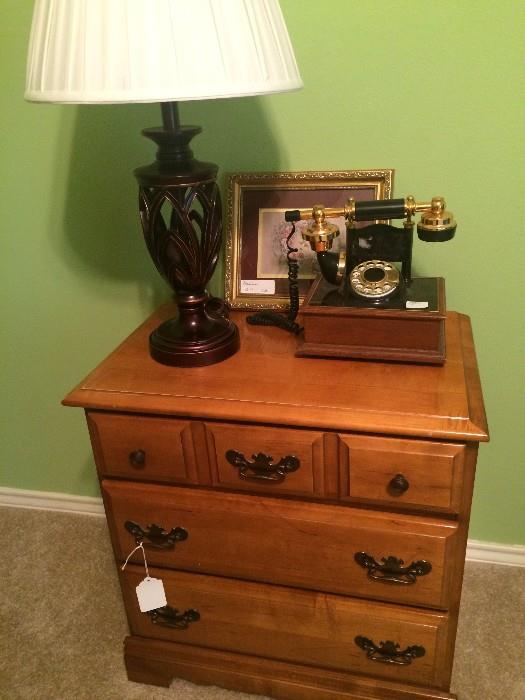 Three drawer nightstand (has matching dresser), lamp, and unique phone, 