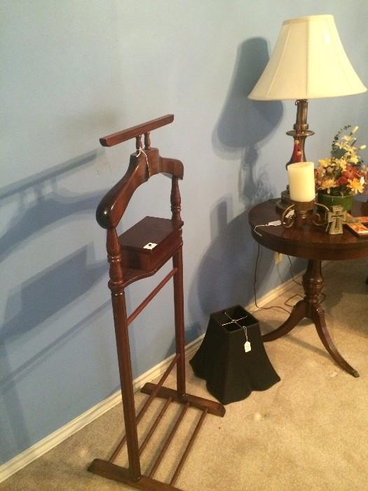 Clothes valet; drum table; one of several lamp shades, and lamps