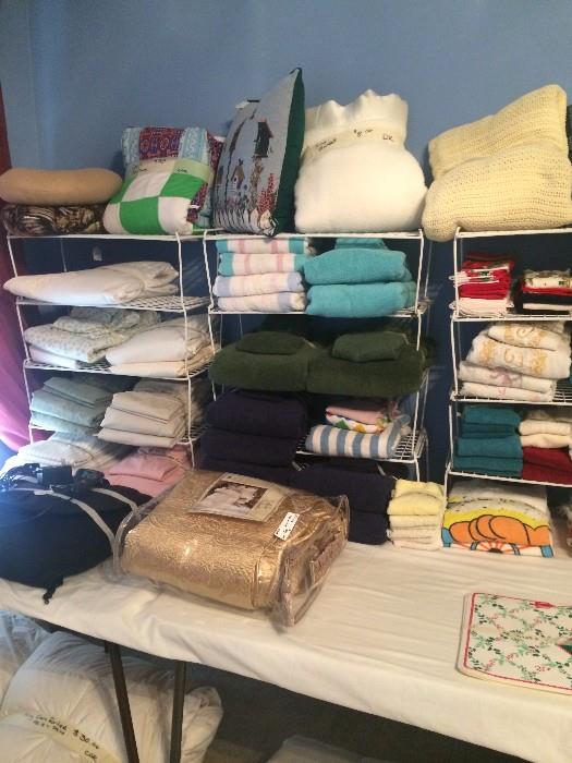 Lots of linens, pillows, & bedding