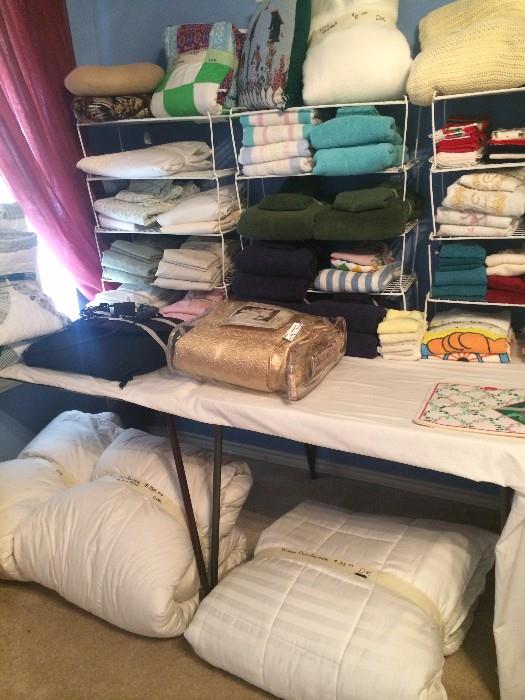 Lots of linens, pillows, bed covers, & bedding