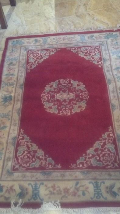 Plush machine-made rug in vivid red wool.            (92"L x 64"W)                                                                            $240 OBO

