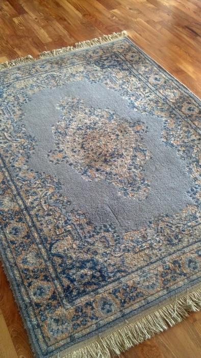 Beautiful machine=made rug in light blue.                (65"L x 48"W)        Price tbd.
