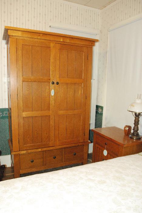 oak armoire- has bar for hanging -or can be for ent center-goes both ways so to speak
