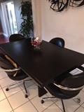 MODERN BLACK KITCHEN TABLE AND 4 ROLLING CHAIRS