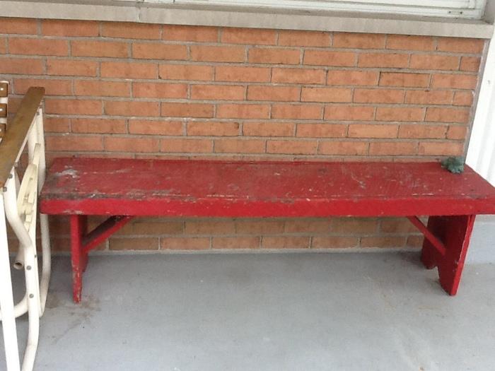 Red wooden bench