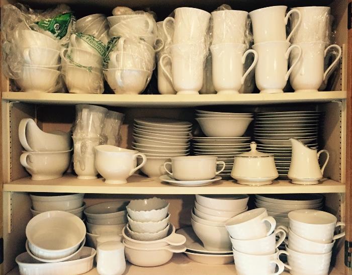 Over 100 pieces Pottery Barn white dinnerware. 