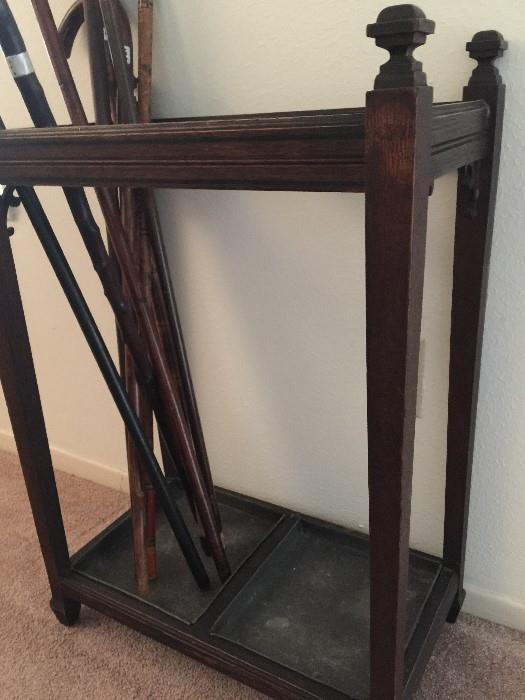 Antique English Double Space CANE or UMBRELLA STAND with lead? bottoms.  Perfect and usable accent piece. Overall Dimensions: 12" x 21"  x 30" highest.