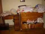 poor picture of a fabulous chest loaded with purses and linens. Also sewing machine