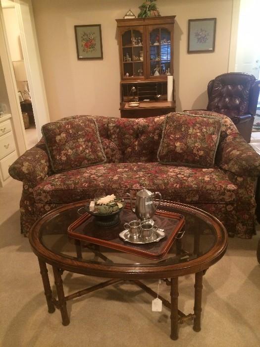 Sofa has matching chair; oval glass top coffee table; pewter tea set