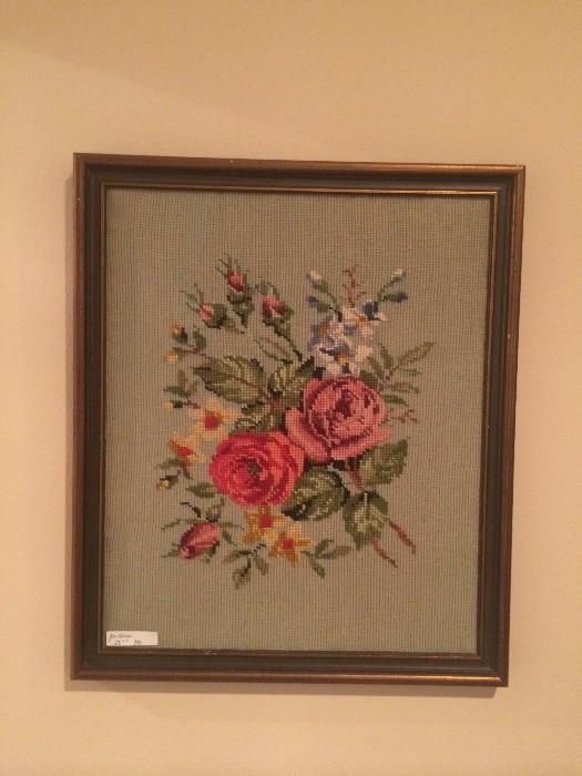 One of several framed needlepoint pictures