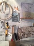 Peg board full of sewing supplies