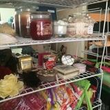 Assortment of make-up bags and candles