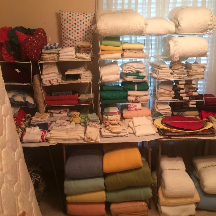 Large selection of blankets and other linens