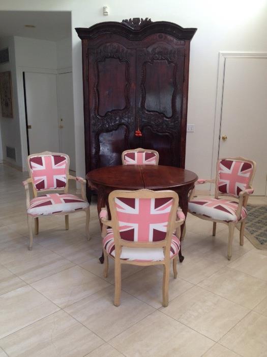 French 18th century provincial Normandy armoire converted inside into a bar, nice dining table and 4  Restoraton Hardware  British flag hupolestered chairs 