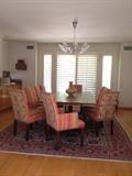 Dining table and chairs Persian rug