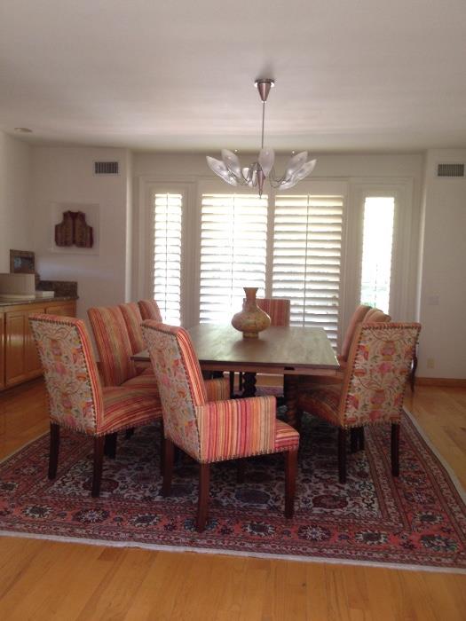 Dining table and chairs Persian rug