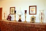 Brass candlesticks, home decor, and artwork