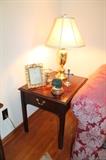 Thomasville end table, brass lamp, and home decor