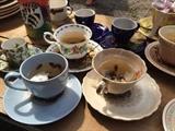 Assorted teacups and saucers