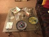 Heavy glass and iron table with beautiful crystal and platters.