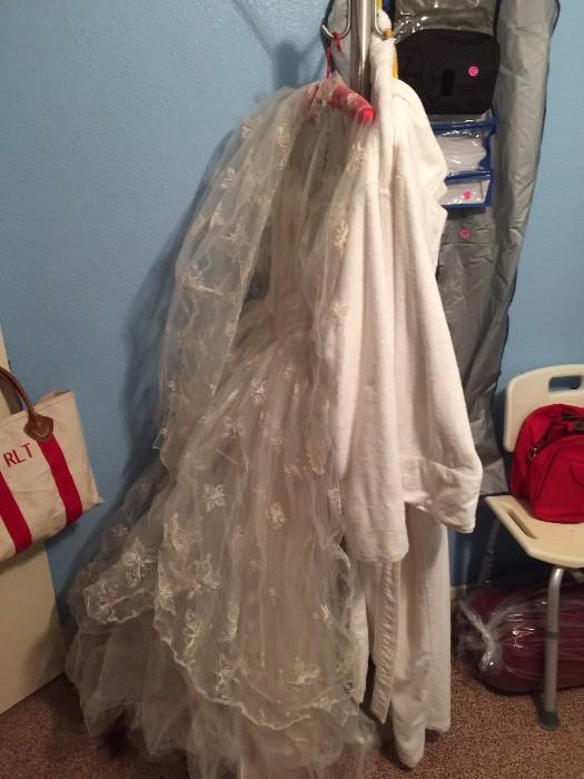 Vintage wedding dress, coat rack, and Spa wraps.