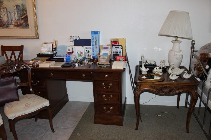 Desk with office and stationary supplies.