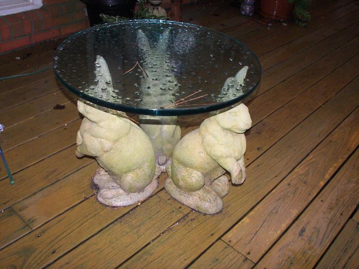 three rabbit glass top table