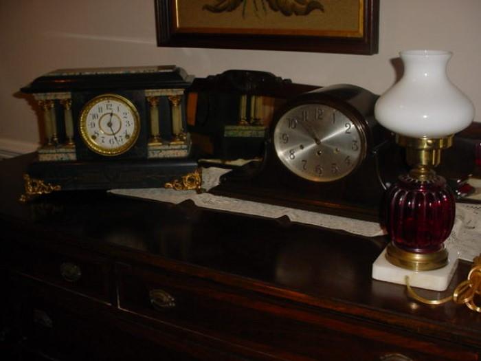 close up of lamps and mantle clocks