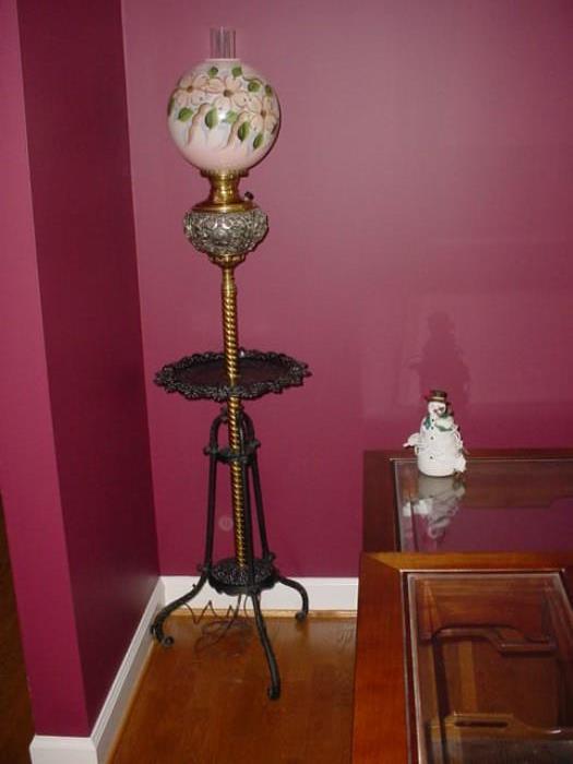 Antique wrought iron, brass, and painted shade floor lamp