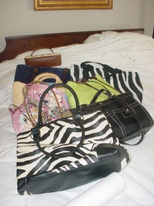 Some of the many fashion bags, purses, etc.