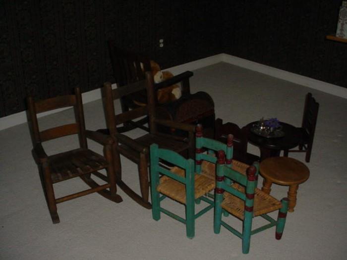 Several child size chairs and rockers