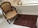 Bokara Small Area Rug. Silk Upholstered Arm Chair.