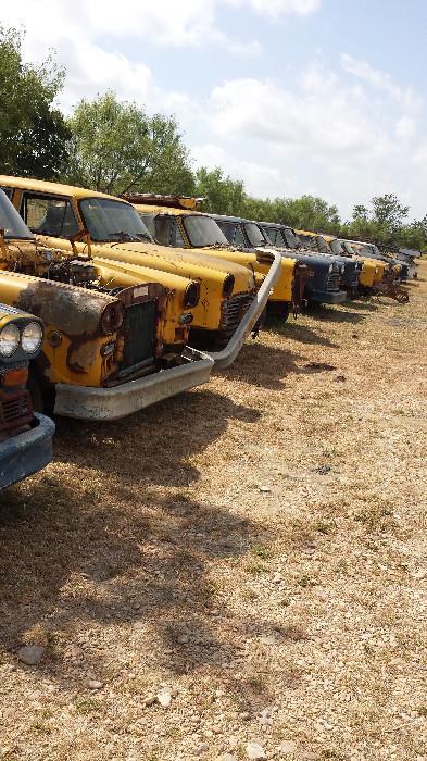 View of the many Checker Cabs waiting to be restored. Meters and other parts available. Ask to see. Aso Conex containers, trailers, and more.