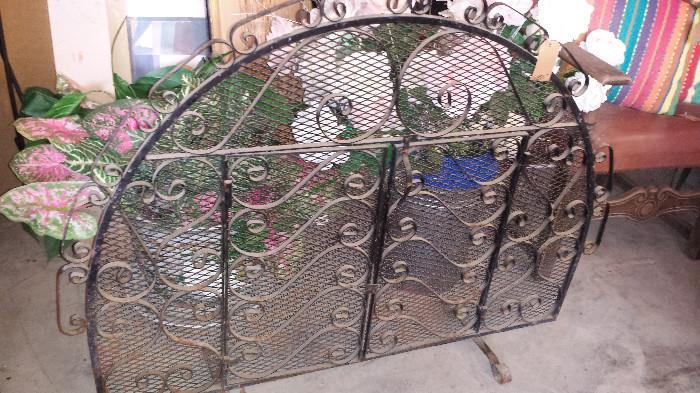 One of several large wrought iron fire screens
