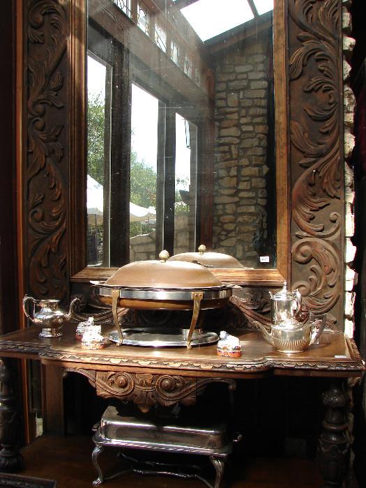 Large buffet serving pieces are available. Carved sideboard. Huge, huge mirror.
