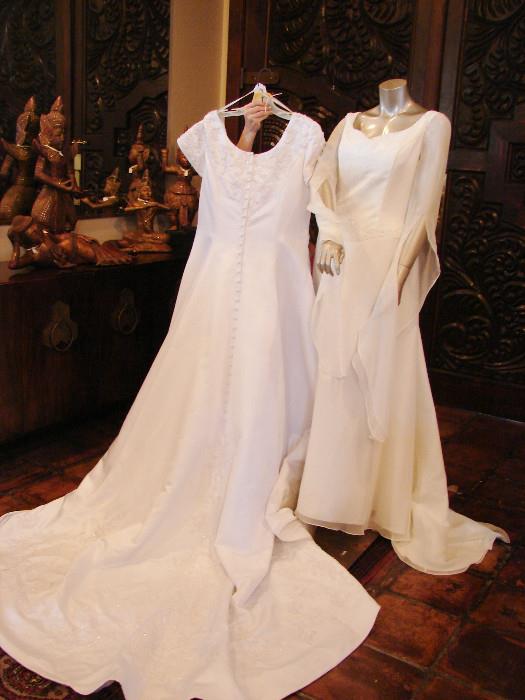 Two of 29 wedding dresses sizes 8-20. Dollie Cole once bought out a bridal boutique to distribute gowns to needy women and these remain. All with tags and in pristine condition.