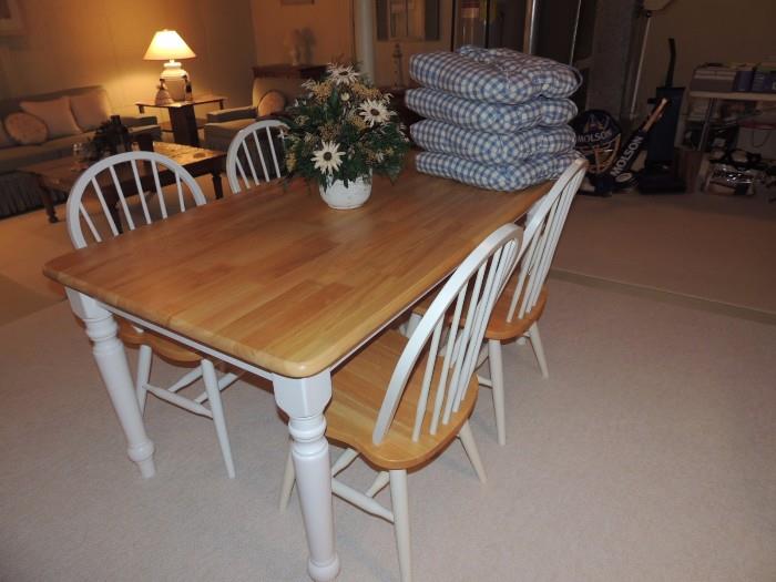farm style table and four chairs, cushions