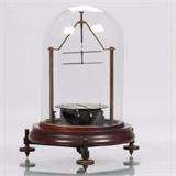 LOT 18 - An Astatic Galvanometer
Dimensions: H: 9 3/4 Dia: 7 1/4 in.
Est: $200-400

Description An Astatic Galvanometer, Late 19th/Early 20th Century. 

Proceeds to benefit the Case Western Reserve University Dayton Miller Scholarship Fund.