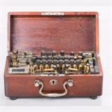 LOT 28 - A Potentiometer with Built-in Galvanometer
Dimensions: H: 11 W: 5 1/2 D: 4 1/4 in.
Est: $200-400

Description A Potentiometer with Built-in Galvanometer, 20th Century.
 
Having provision for an external galvanometer.
 
