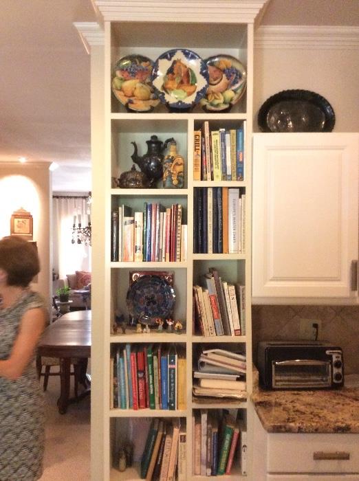 lots of cookbooks, old silverplate and Italian, French and Mexican pottery. 